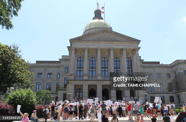 Abortion rights advocates rally in front of the Georgia State Capitol in Atlanta to protest new restrictions on abortions that have been passed in...