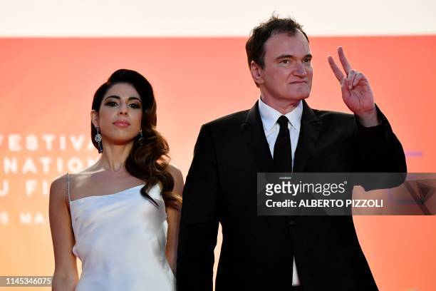 Film director Quentin Tarantino and his wife Israeli singer Daniela Pick leave the Festival Palace after the screening of the film "Once Upon a...