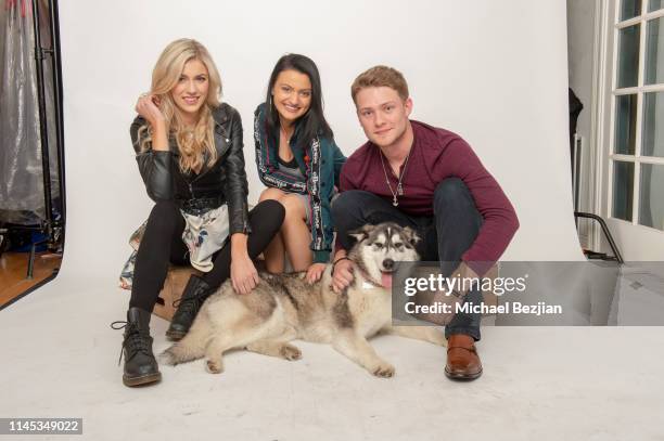Meredith Vancuyk, Laci Mercede and Lou Wegner with Luna the Husky of Kids Against Animal Cruelty pose for a portrait at Giveback Day at TAP - The...