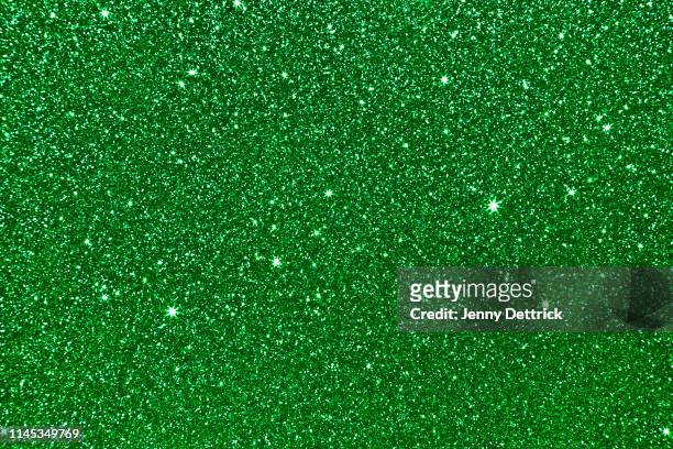 green glitter background - glitter stock pictures, royalty-free photos & images