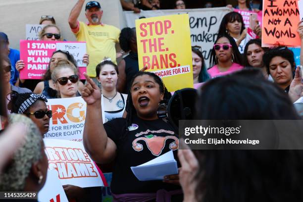 Woman speaks during a protest against recently passed abortion ban bills at the Georgia State Capitol building, on May 21, 2019 in Atlanta, Georgia....