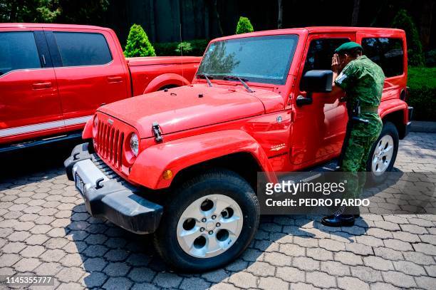 A Mexican sooldier looks a seized Jeep Wrangler that will be... News Photo  - Getty Images