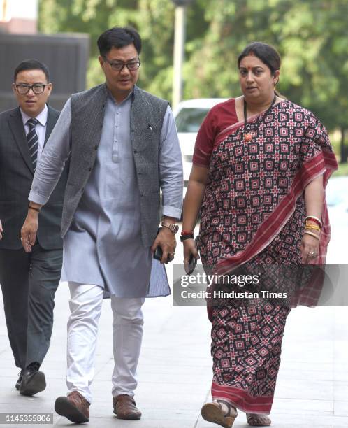 Union Textiles Minister Smriti Irani with Kiren Rijiju arrives to a NDA ministers meeting during the Union Council of Ministers meet meant to thank...