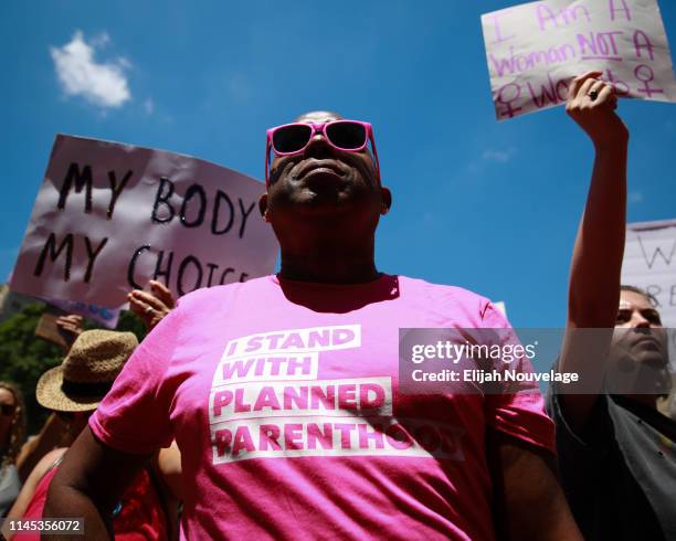 Man wears a "I stand with Planned Parenthood" shirt at a protest against recently passed abortion ban bills at the Georgia State Capitol building, on...