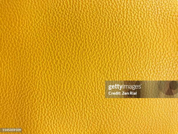 vibrant yellow colored textured material part of a handbag - leder handtasche stock-fotos und bilder