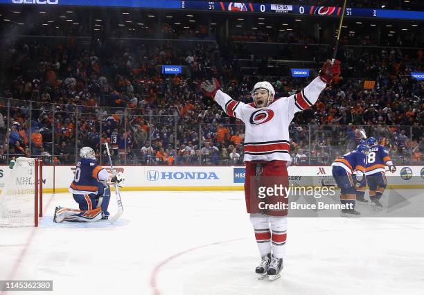 The Carolina Hurricanes celebrates a 1-0 overtime win over the New York Islanders in Game One of the Eastern Conference Second Round during the 2019...