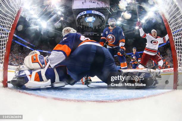 Teuvo Teravainen of the Carolina Hurricanes celebrates Jordan Staal game winning overtime goal as Robin Lehner and Nick Leddy of the New York...