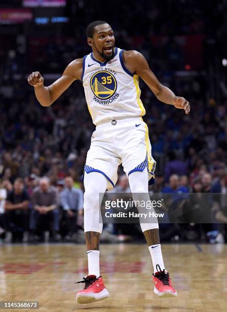 Kevin Durant of the Golden State Warriors reacts to his three pointer in the first half against the LA Clippers during Game Six of Round One of the...