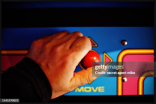 playing video game - videospielhalle stock-fotos und bilder