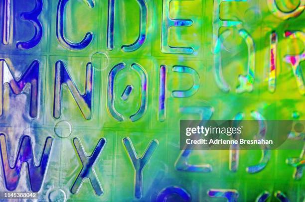 alphabet stencil with prism color and light effects - alphabet neon stock pictures, royalty-free photos & images