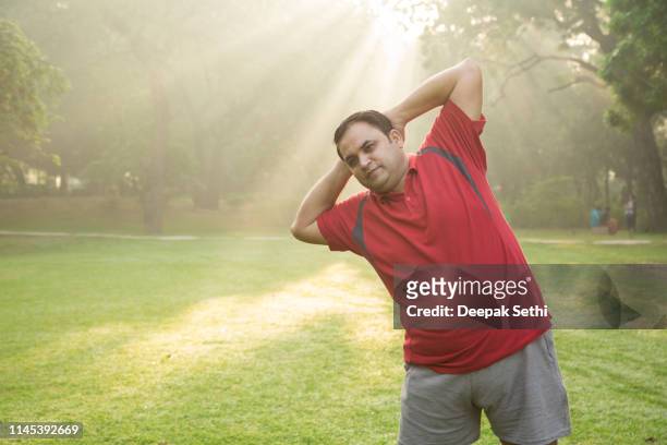 morning workout - stock images - fat asian man stock pictures, royalty-free photos & images