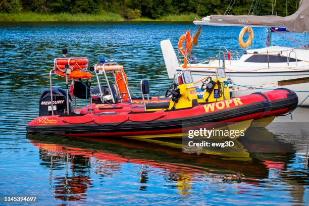 lifeguard's rescue motorboats on the lake - gizycko stock pictures, royalty-free photos & images