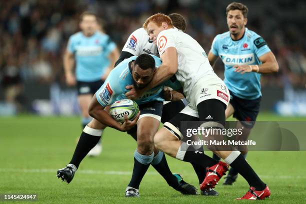 Sekope Kepu of the Waratahs Is tackled during the round 11 Super Rugby match between the Waratahs and Sharks at Bankwest Stadium on April 27, 2019 in...