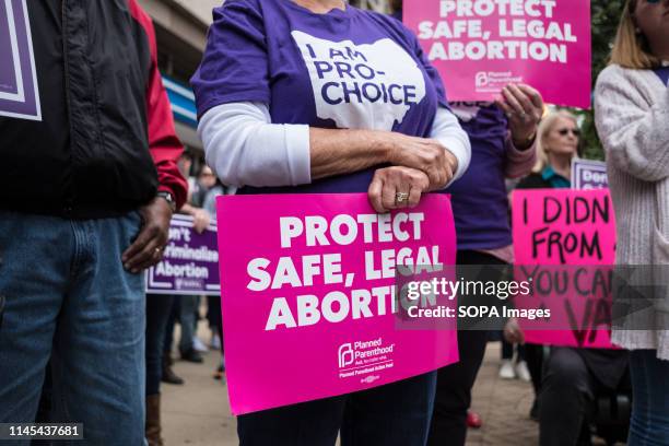 An activist seen holding a placard that says protect safe, legal abortion during the protest. Abortion rights activists took part in stop the bans...