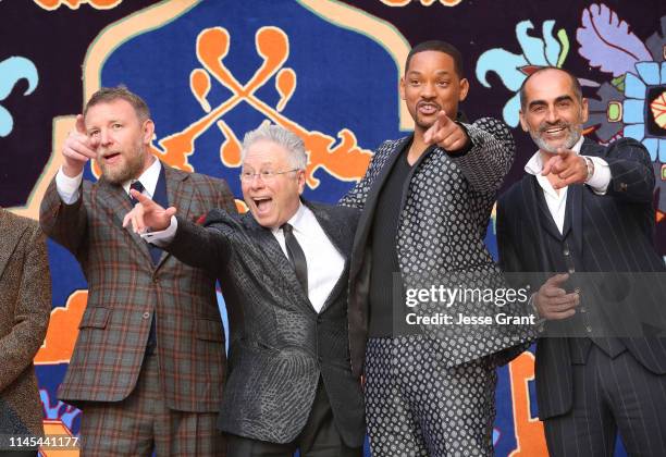 Director Guy Ritchie, Composer Alan Menken, Will Smith and Navid Negahban attend the World Premiere of Disneys "Aladdin" at the El Capitan Theater...