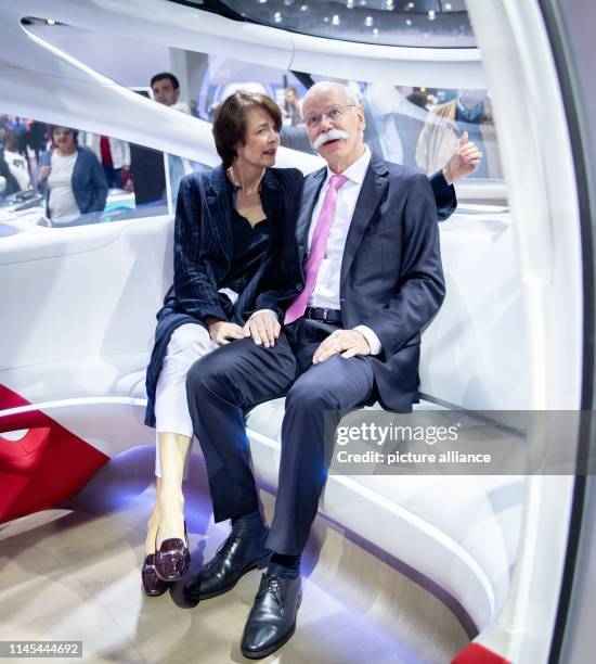 Dieter Zetsche, outgoing Chairman of the Board of Management of Daimler AG, sits with his wife Anne in Vision Urbanetic Konzeptbus in the vehicle...