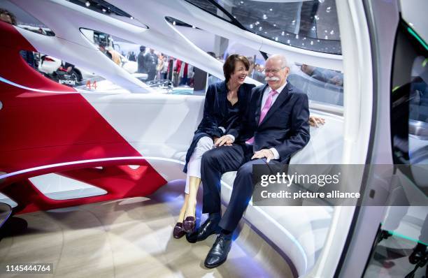 Dieter Zetsche, outgoing Chairman of the Board of Management of Daimler AG, sits with his wife Anne in Vision Urbanetic Konzeptbus in the vehicle...