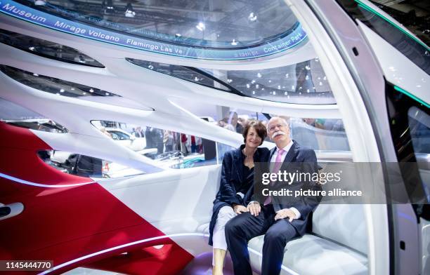 Dieter Zetsche, outgoing Chairman of the Board of Management of Daimler AG, sits with his wife Anne in Vision Urbanetic Konzeptbus in the vehicle...