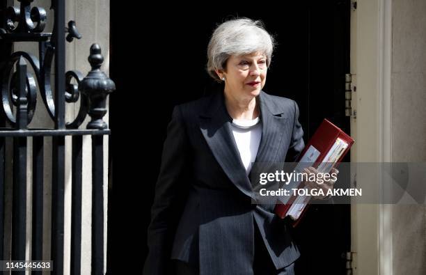 Britain's Prime Minister Theresa May leaves 10 Downing Street in London on May 22 ahead of the weekly Prime Minister's Questions question and answer...