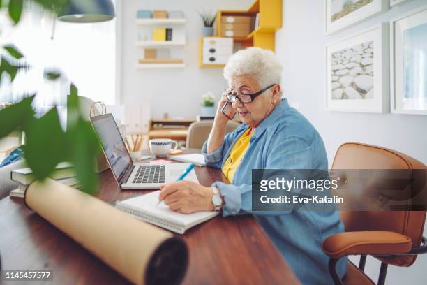 senior woman at home - 70 79 years stock pictures, royalty-free photos & images