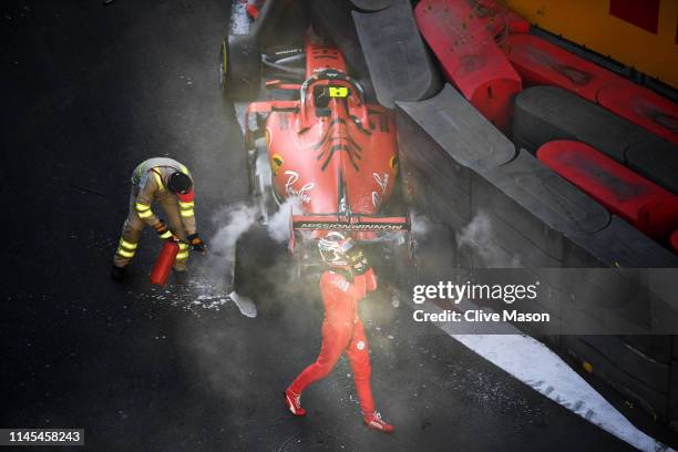 Charles Leclerc of Monaco and Ferrari looks dejected as he walks from his car after crashing during qualifying for the F1 Grand Prix of Azerbaijan at...