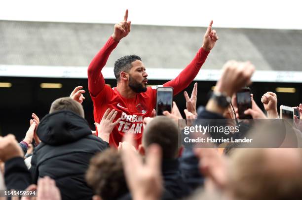 Jobi McAnuff of Leyton Orient celebrates with fans as they win the title after the Vanarama National League match between Leyton Orient and Braintree...