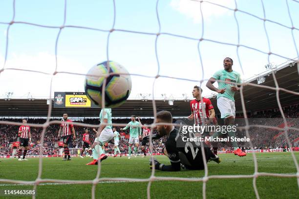 Callum Wilson of AFC Bournemouth scores his team's second goal past Angus Gunn of Southampton during the Premier League match between Southampton FC...