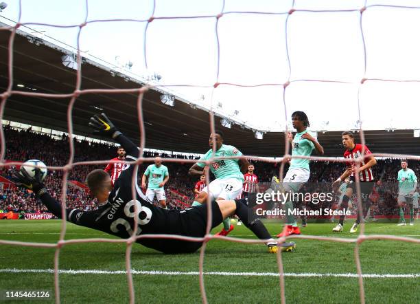 Callum Wilson of AFC Bournemouth scores his team's second goal past Angus Gunn of Southampton during the Premier League match between Southampton FC...