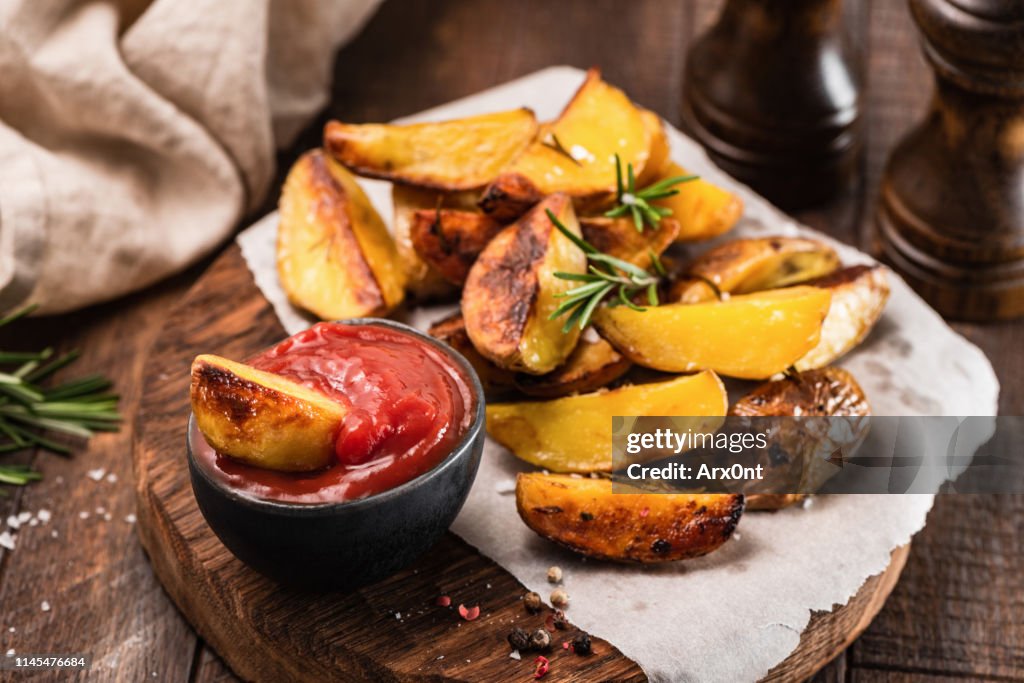 Rosemary baked potato wedges with ketchup
