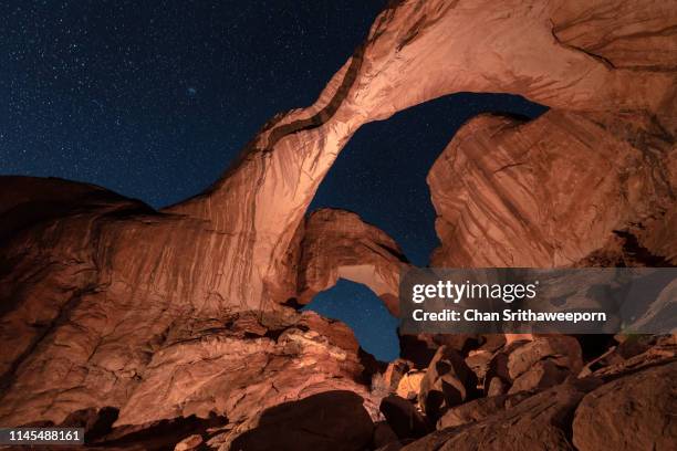 double arch, arches national park, moab utah - starry vault stock pictures, royalty-free photos & images