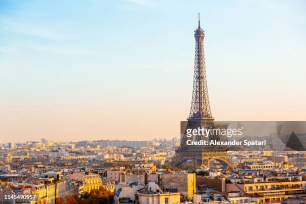 eiffel tower and paris skyline with clear blue sky on a sunny day, paris, france - eiffel tower stock pictures, royalty-free photos & images