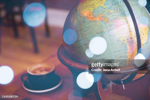 vintage globe, cozy coffee shop, no people, travel, adventure, latte, dreamy - map of latin america stock pictures, royalty-free photos & images