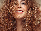 Brown haired woman with voluminous hairstyle