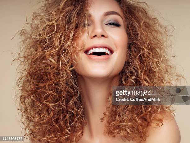 brown haired woman with voluminous hairstyle - wavy hair stock pictures, royalty-free photos & images