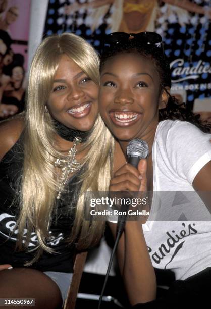 Lil' Kim and Brandy during New Fashion Campaign For Candie's Featuring Lil' Kim and Brandy at Fashion Cafe in New York City, New York, United States.