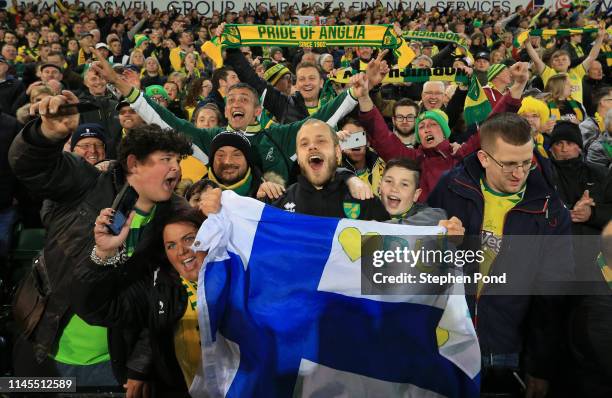 Teemu Pukki of Norwich City celebrates with their fans as his team secure promotion to the Premier League following their victory in the Sky Bet...