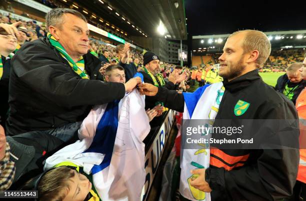 Teemu Pukki of Norwich City celebrates with their fans as his team secure promotion to the Premier League following their victory in the Sky Bet...