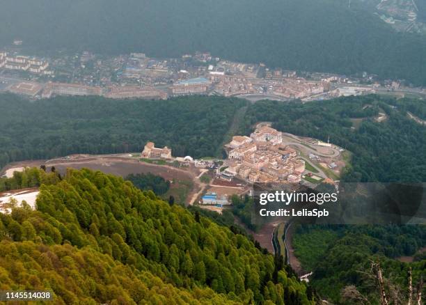 view from the mountains to the olympic village, krasnaya polyana - sochi russia stock pictures, royalty-free photos & images