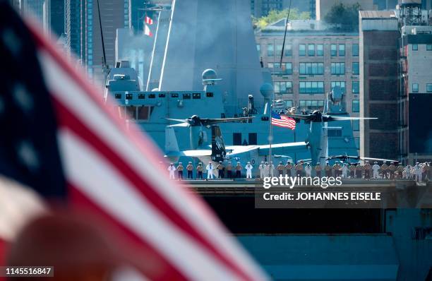 Sailors and Marines stand on the deck of the USS New York as the US Navy vessel takes part in Fleet Week 2019, on May 22 in New York.