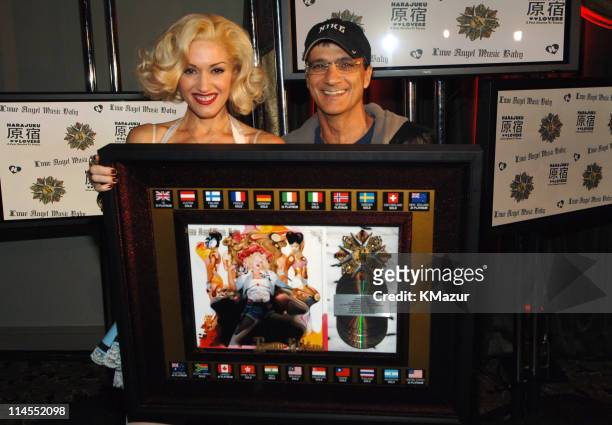 Gwen Stefani, with multi-platinum sales award for album "Love. Angel. Music. Baby.", and IGA's Jimmy Iovine