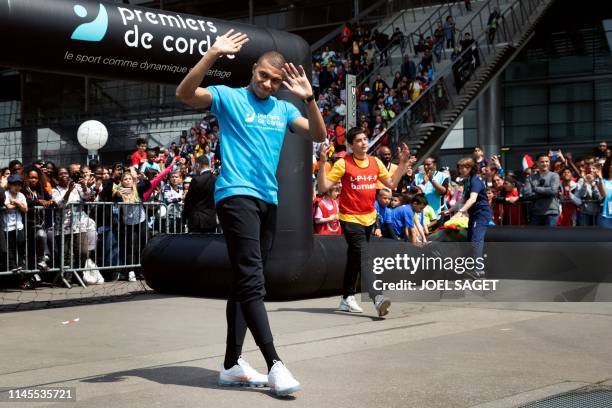 Paris Saint-Germain's French forward Kylian Mbappe takes part in a football match with children from the 'Premiers de Cordee' Association at the...