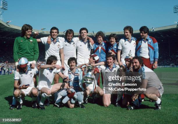 West Ham United players celebrate with the trophy after the FA Cup Final between West Ham United and Arsenal at Wembley Stadium on May 10, 1980 in...