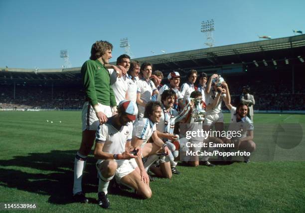 West Ham United players celebrate with the trophy after the FA Cup Final between West Ham United and Arsenal at Wembley Stadium on May 10, 1980 in...