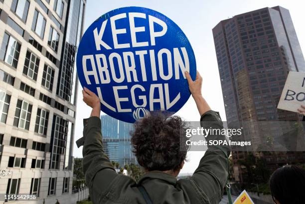 An activist seen holding a placard that says Keep Abortion Legal during the protest. Women rights activists protested against restrictions on...