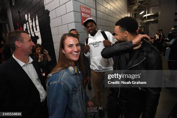 Stephen Curry of the Golden State Warriors shares a laugh with Oregon Ducks Basketball Player, Sabrina Ionescu, after advancing to the NBA Finals...