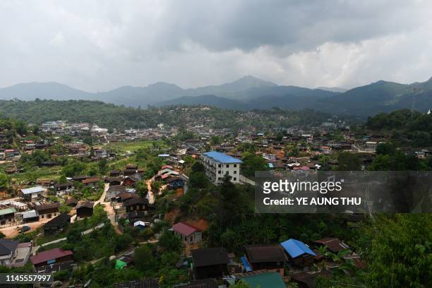 This photo taken on May 16, 2019 shows a general view of Mogok town, north of Mandalay. - Burrowing deep underground, thousands of informal miners...