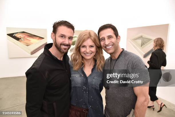 Braden Pollock, Lisa Bloom and Roger Wolfson attend the opening of Robert Russell's "Book Paintings" exhibition at Anat Ebgi Gallery on April 27,...