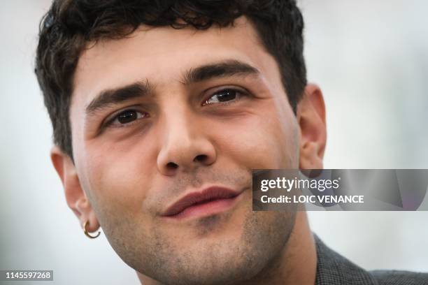 Canadian film director Xavier Dolan poses during a photocall for the film "Matthias and Maxime" at the 72nd edition of the Cannes Film Festival in...