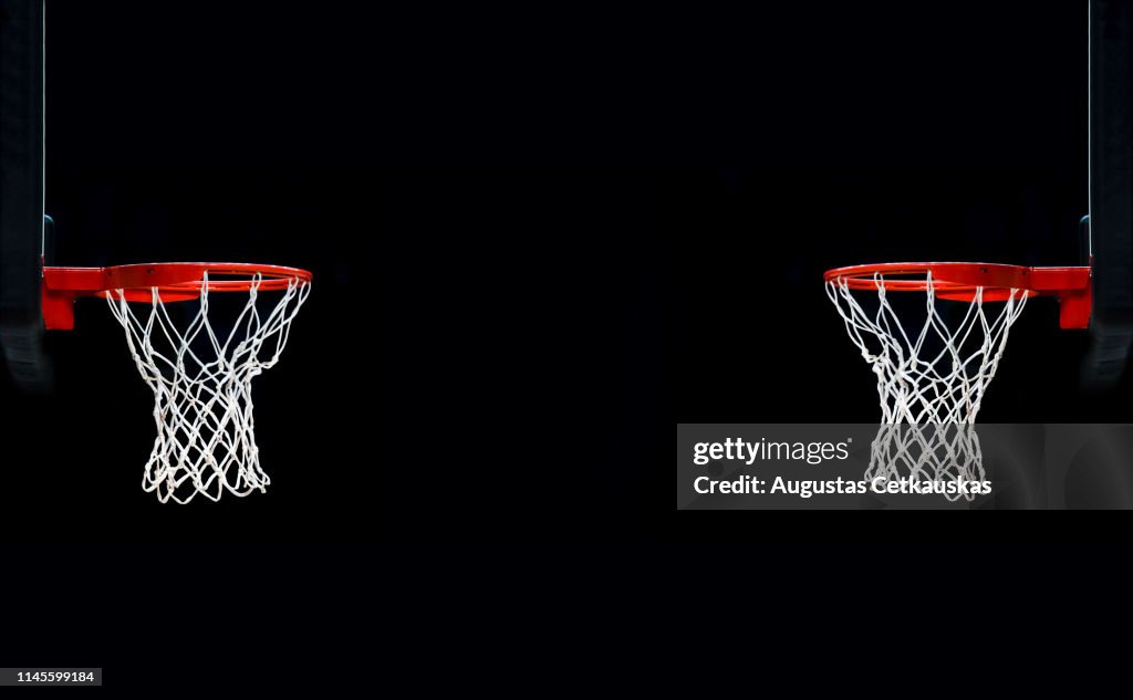 Basketball Hoops Against Black Background