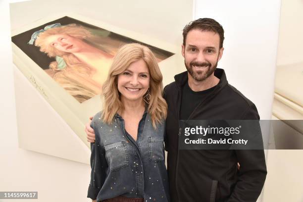 Lisa Bloom and Braden Pollock attend the opening of Robert Russell's "Book Paintings" exhibition at Anat Ebgi Gallery on April 27, 2019 in Los...